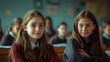 © Eakanan - Two female students sitting in a classroom