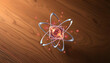 © Taufiq - Glowing Atomic Structure with Red Core and Silver Orbits on a Wooden Backdrop