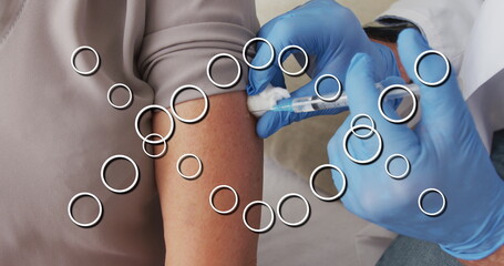 Poster - Image of dna strand over caucasian doctor vaccinating