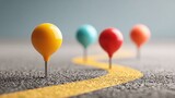 A row of colorful pins placed along a road representing strategic planning and milestones in project development journey