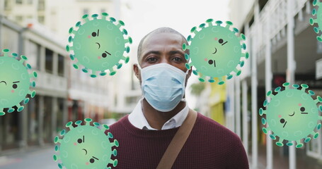Poster - Image of falling covid 19 cells over african american men wearing face mask