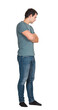 © 1STunningART - Full length side view portrait of thoughtful young man hands crossed looking down isolated on transparent background