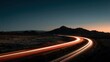 © ShahinAlam - A 4K photo of desert highway with sun setting and car light trails.