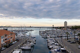 Marina with sailing ships of Port de Bouc at dawn with sunrise in spring in France