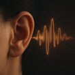 © Iurii - Sounds and waves interact near an ear, illustrating sound perception and listening