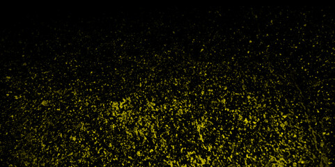 Wall Mural - Golden dust particle on black background. Gold glitter texture explosion of confetti isolated on black celebratory abstract background. Yellow particle explosion on black background.