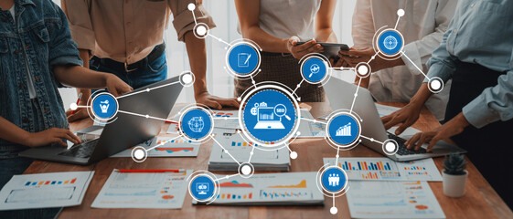 Leinwandbilder - Analyst team utilizing BI Fintech to analyze and pointing at financial dashboard paper office. Businesspeople examining report paper on table for business insight. Panorama shot. Scrutinize Amity