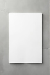 Aufkleber - A small white square is stuck on a gray wall
