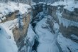 © Popelniushka - Serene Winter Brook: A Flowing River Glistening with Ice and Snow in a Majestic Canyon Landscape