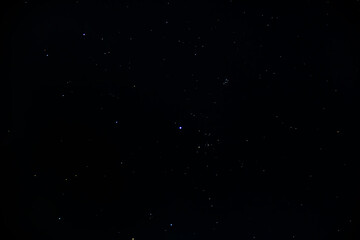the clear black night sky is strewn with bright glowing stars and constellations