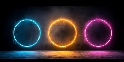 Poster - Three neon colored circles are lit up in a dark room. The circles are orange, blue, and pink