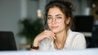 © Sergey Fox - Focused professional financial it specialist latin hispanic business lady working concentrated on laptop pc sitting in office.