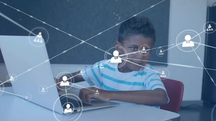Poster - Boy gesturing at laptop and activating technology network icons while typing for visualizing data