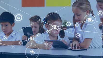 Poster - Seated girl glancing at peer for help, standing girl guiding tablet and spawning classroom network