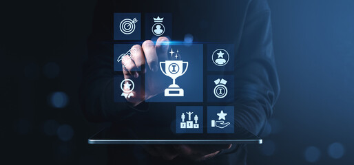 Poster - Man interacting with digital achievement icons on tablet screen symbolizing success, reward, and performance evaluation in modern tech environment.