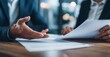 © Stock Pix - Business meeting in progress with documents being reviewed.  The details of the arrangement are being carefully discussed and finalized.
