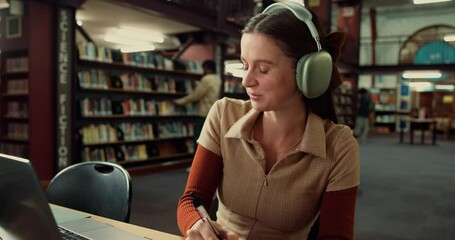 Poster - Laptop, woman and student with headphones in library studying for university exam with textbooks. Education, computer and female person writing with learning for college test or assignment on campus.
