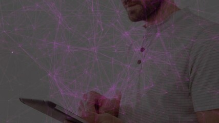 Aufkleber - Man steadying tablet by wall tapping screen and swiping through network data under purple overlay