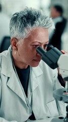 Poster - Scientist, mature woman and microscope at lab for medical research, innovation and pharma study. Person, zoom and vaccine development with sample, virus or bacteria with lens, equipment and analysis