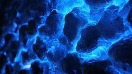 Poster - Close up view of a unique rock formation illuminated by blue lights, suitable for use in futuristic or technological themed designs