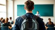 © realone952 - A late student looks directly at a male teacher in class and listens to his comments