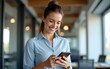 © happy - Happy businesswoman texting on cell phone in office. High quality