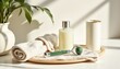 © Athiphat - natural flat lay of a morning skincare ritual featuring a facial cleanser bottle, jade roller