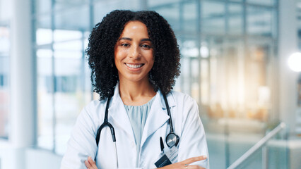 Poster - Doctor, woman and smile with arms crossed in portrait, hallway and pride for healthcare services at clinic. Person, medical professional and happy with confidence, career and hospital in Costa Rica