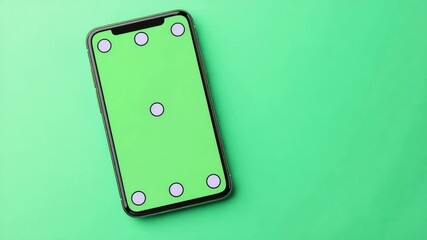 Poster - Smartphone with a blank green screen on a blue background, perfect for app or web design mockups