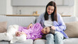© Home-stock - Loving mother comforting and talking to her teen daughter, tired upset girl lying on mom knees, sitting on sofa at home