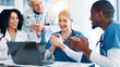 © peopleimages.com - Doctors, woman and team with applause, laptop and support with goals, results and celebration. People, group and men with nurse for success, promotion or achievement in career with cheers at hospital
