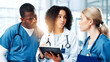 © peopleimages.com - Medical, meeting or tablet with doctors and nurses in hospital together for discussion or report. Collaboration, healthcare and insurance with serious medicine team in clinic for diagnosis review