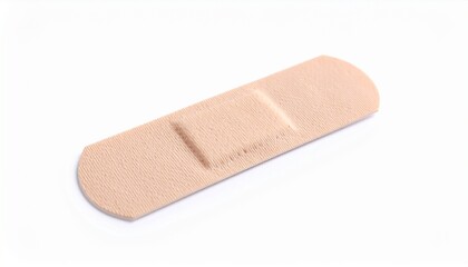 single small beige adhesive bandage isolated on white background