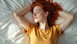 © Vadym - Young woman with red hair relaxes on white bed. Serene lady embodies tranquility, peace in expression. Soft light enhances peaceful mood. Calm person resting, dreaming, enjoying joy of mind body soul.