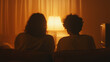 © photo for everything - Cozy evening with loved ones at home with old TV set. The silhouettes of people sit on the sofa illuminated by a lamp in a warm color cast, sharing a moment.