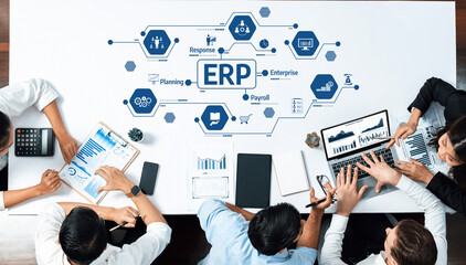 Poster - A diverse group of professionals collaborates in a modern office setting, analyzing data and discussing strategies for effective enterprise resource planning and business growth. Amity