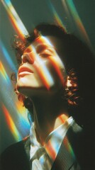 Poster - A female artist stands against a wall, eyes closed, illuminated by vibrant prism effects. The play of light creates a striking contrast on her facial features, enhancing her artistic expression