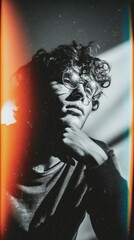 Poster - A confident person sits with a hand on their chin, gazing thoughtfully. Colorful light leaks frame their face, enhancing the dramatic atmosphere of the moment