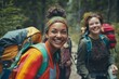 © grPix - A diverse LGBTQ family on a hiking trip, walking through a forest trail, backpacks, joyful expressions