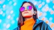 © adityan - A young woman with dark hair, wearing a black leather jacket, orange turtleneck, pink-lensed sunglasses, and wireless earbuds, stands against a vibrant bokeh background