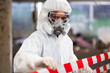 © NVB Stocker - Officials from the Department of Hazardous substances control bureau is investigating the leak of a hazardous chemical in chemical industry plant. Man with safety protective mask in factory