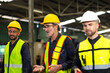 © NVB Stocker - Professional team working at workplace. Unity and teamwork concept. Group portrait engineer factory manager worker and mechanic team together in factory workplace