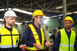© NVB Stocker - Professional team working at workplace. Unity and teamwork concept. Group portrait engineer factory manager worker and mechanic team together in factory workplace