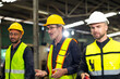 © NVB Stocker - Professional team working at workplace. Unity and teamwork concept. Group portrait engineer factory manager worker and mechanic team together in factory workplace
