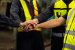 © NVB Stocker - team hands together. Professional team working at workplace. Unity and teamwork. Group portrait engineer factory manager worker and mechanic team together in factory workplace