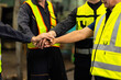 © NVB Stocker - team hands together. Professional team working at workplace. Unity and teamwork. Group portrait engineer factory manager worker and mechanic team together in factory workplace