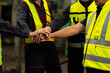 © NVB Stocker - team hands together. Professional team working at workplace. Unity and teamwork. Group portrait engineer factory manager worker and mechanic team together in factory workplace