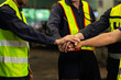 © NVB Stocker - team hands together. Professional team working at workplace. Unity and teamwork. Group portrait engineer factory manager worker and mechanic team together in factory workplace