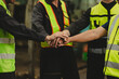 © NVB Stocker - team hands together. Professional team working at workplace. Unity and teamwork. Group portrait engineer factory manager worker and mechanic team together in factory workplace