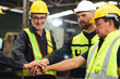 © NVB Stocker - team hands together. Professional team working at workplace. Unity and teamwork. Group portrait engineer factory manager worker and mechanic team together in factory workplace
